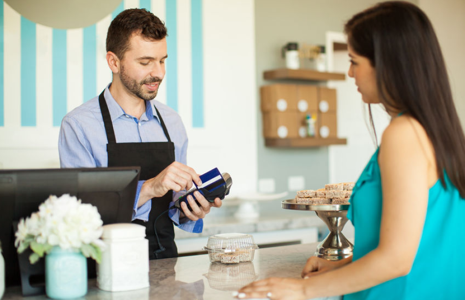 woman buying at a coffee shop